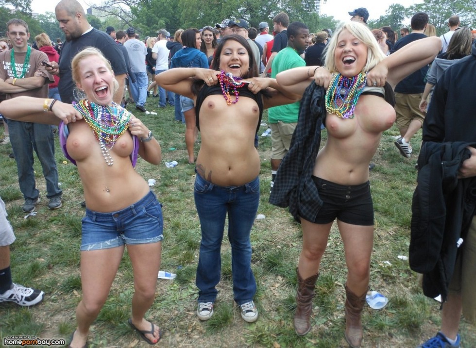 Girls show breasts at the festival