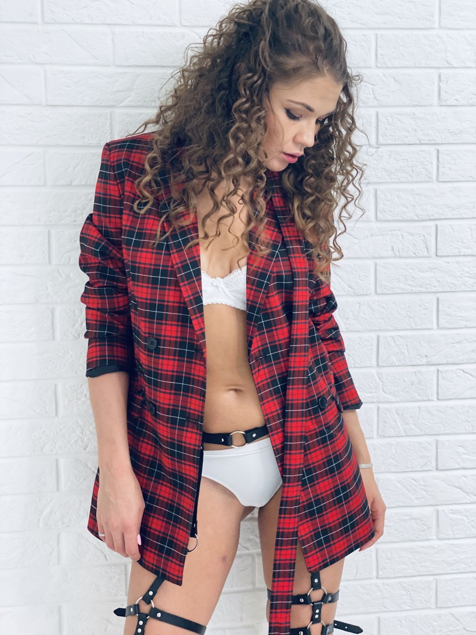 Julia Sanina in a checkered shirt