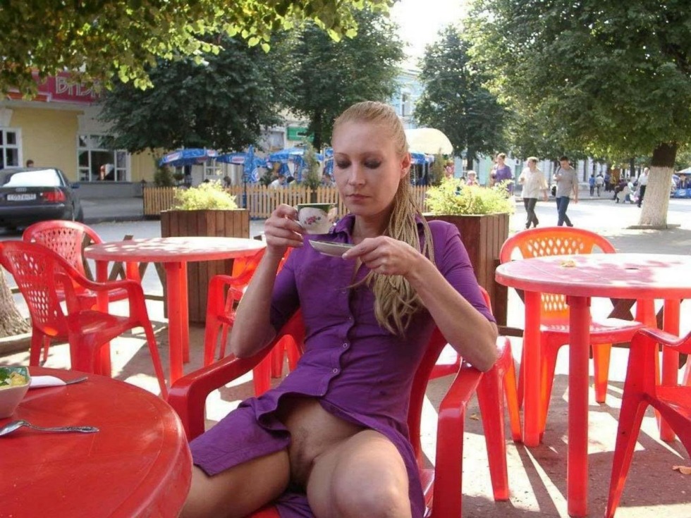 Girl without panties in a cafe on the street