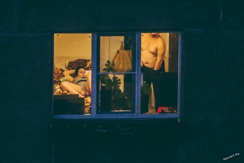 Naked woman in the window opposite