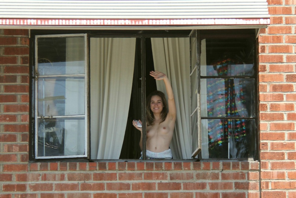 Shows tits in the window