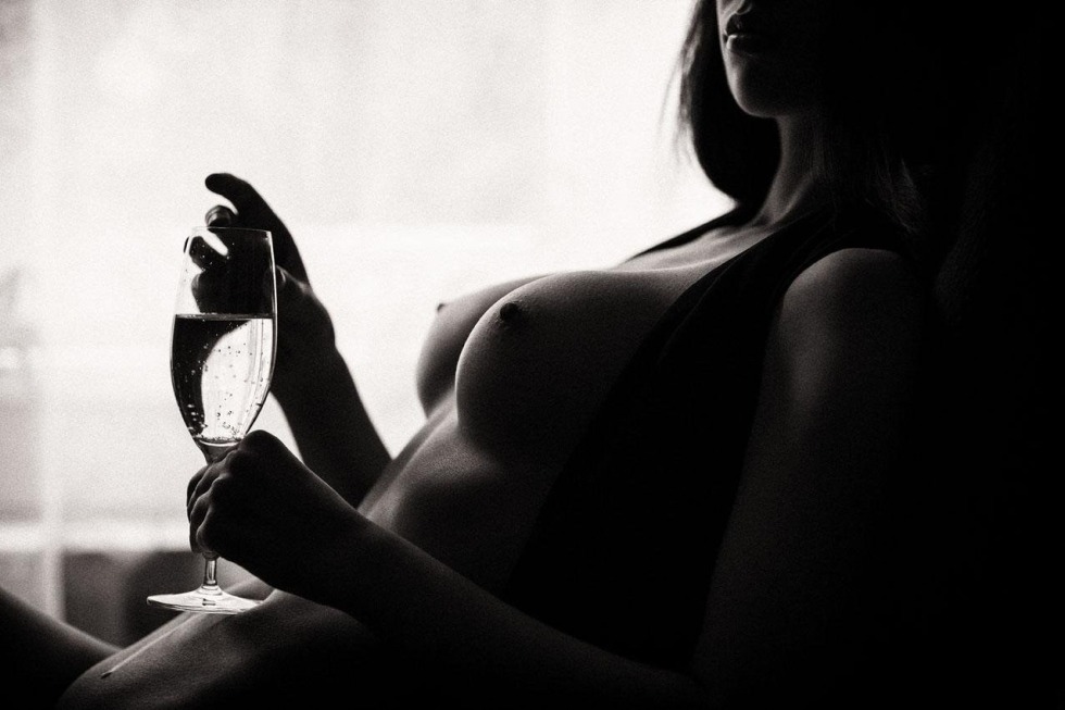 Erotic photo shoot with a glass of wine