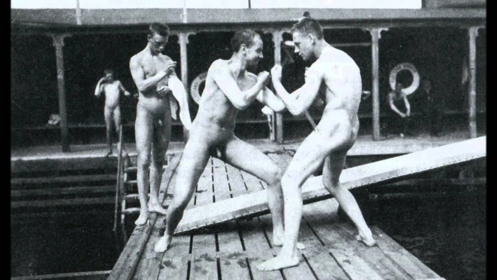 Naked men in a retro bathhouse