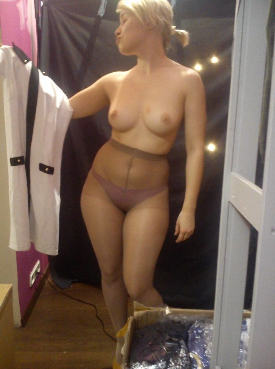 Naked women in fitting rooms