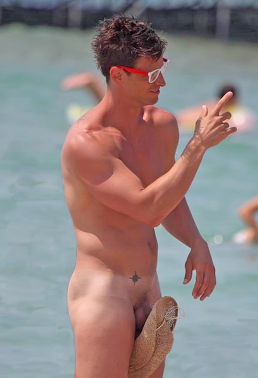 Naked guys on the beach in swimming trunks