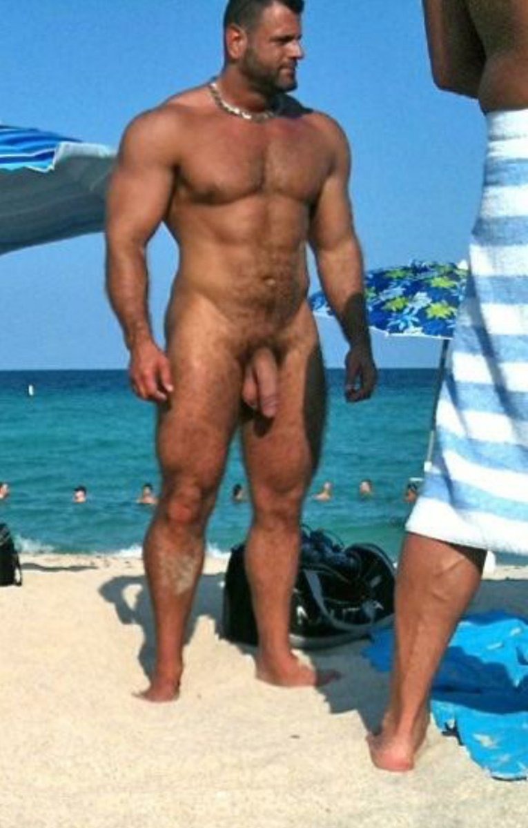 A guy with a big dick on the beach
