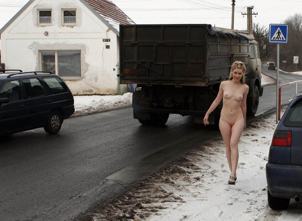 The woman undressed on the road