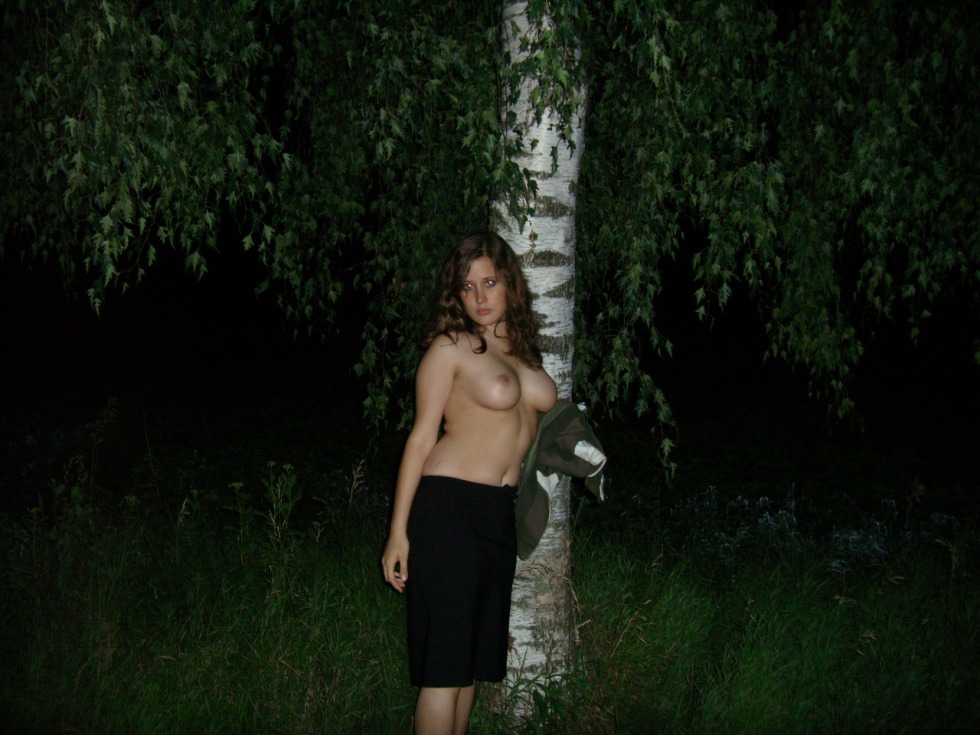 The girl undressed in the forest at night