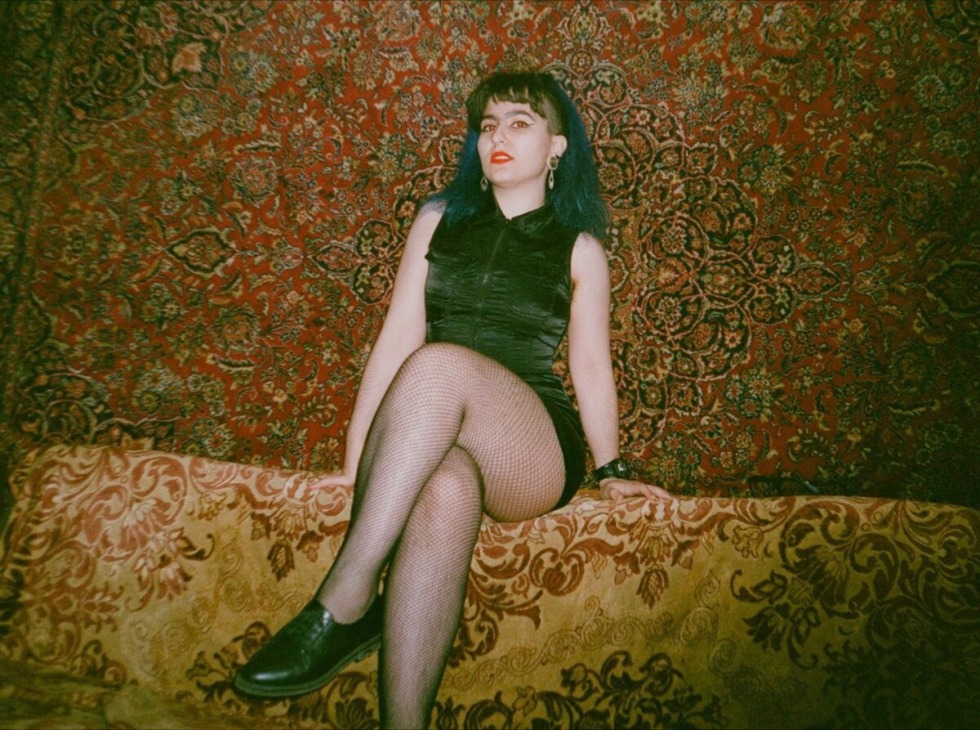 Woman against the background of carpets