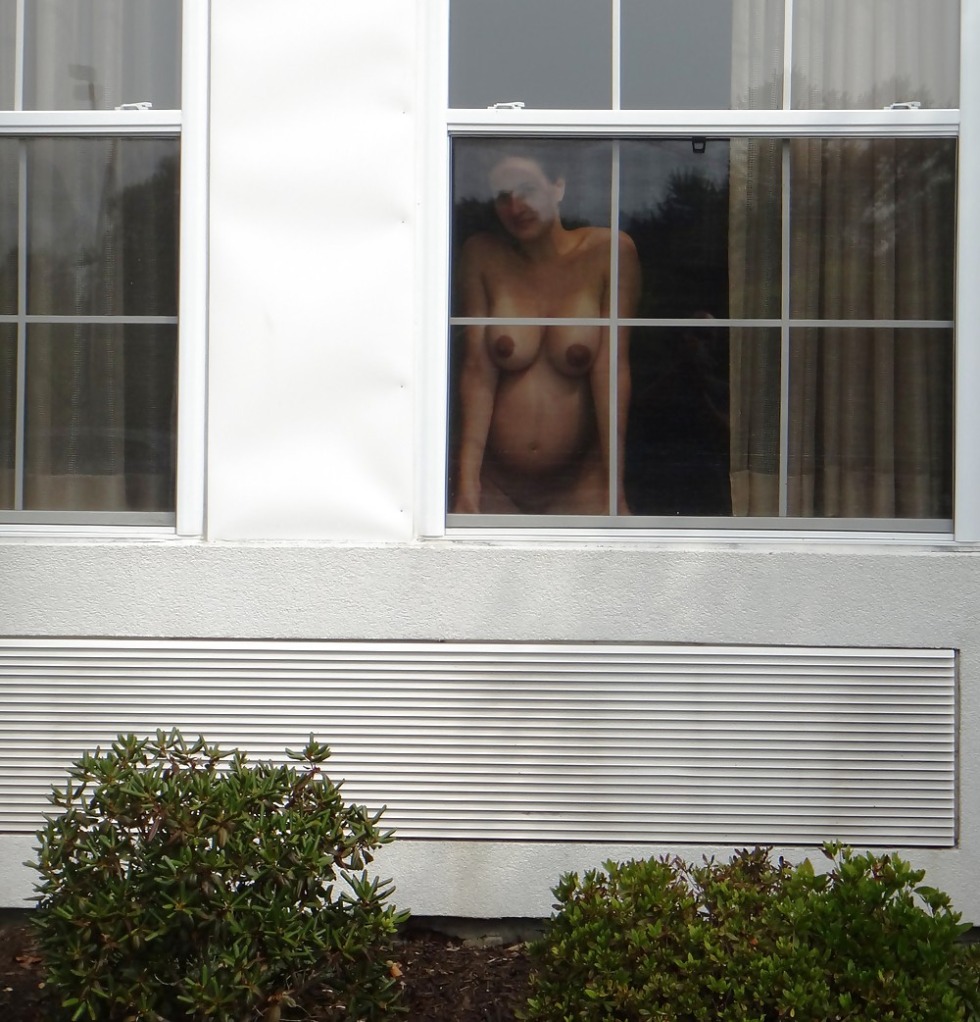 Naked women in windows and balconies