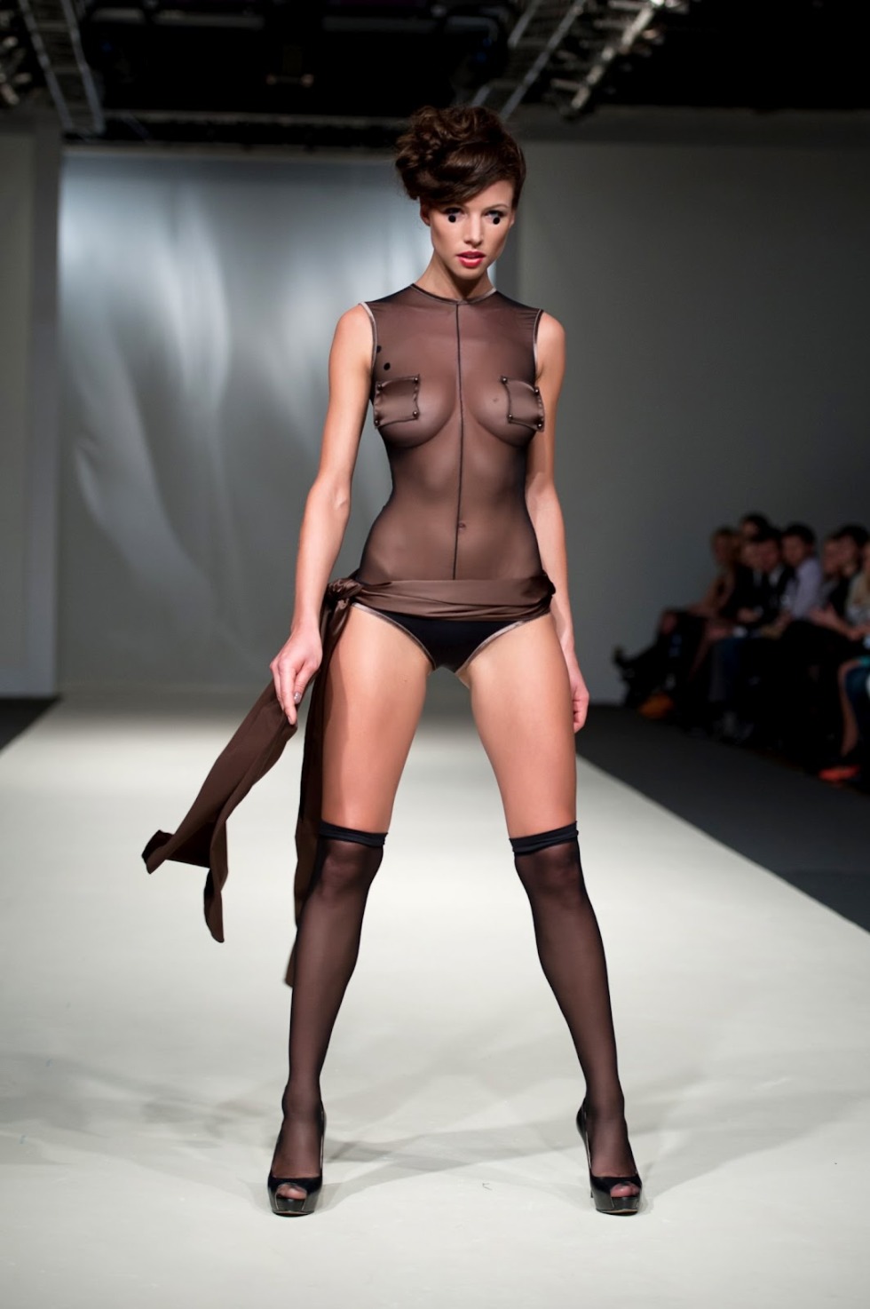 Naked fashion model on the catwalk
