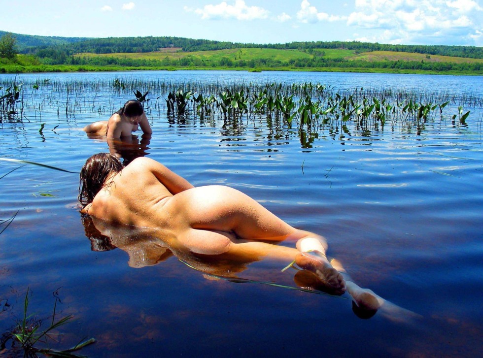 Naked women on the lake
