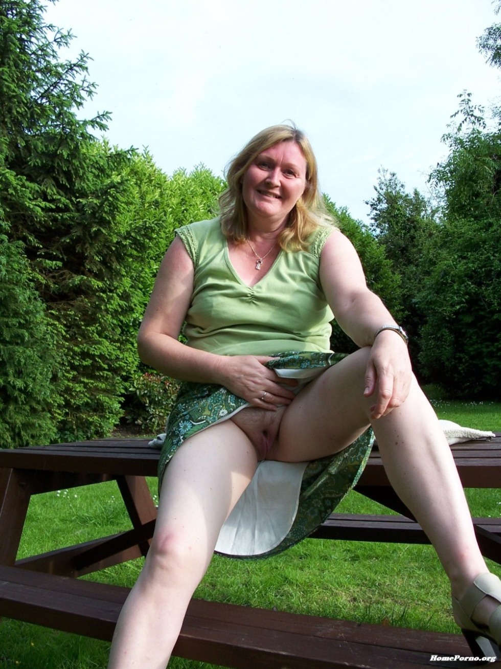 Grandmas under a skirt without panties in nature