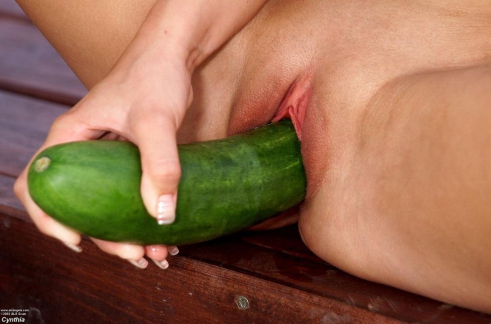 Huge cucumber in the pussy