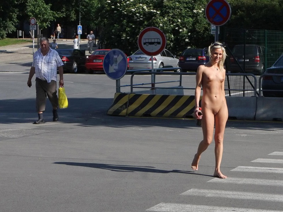 Walks naked along the street