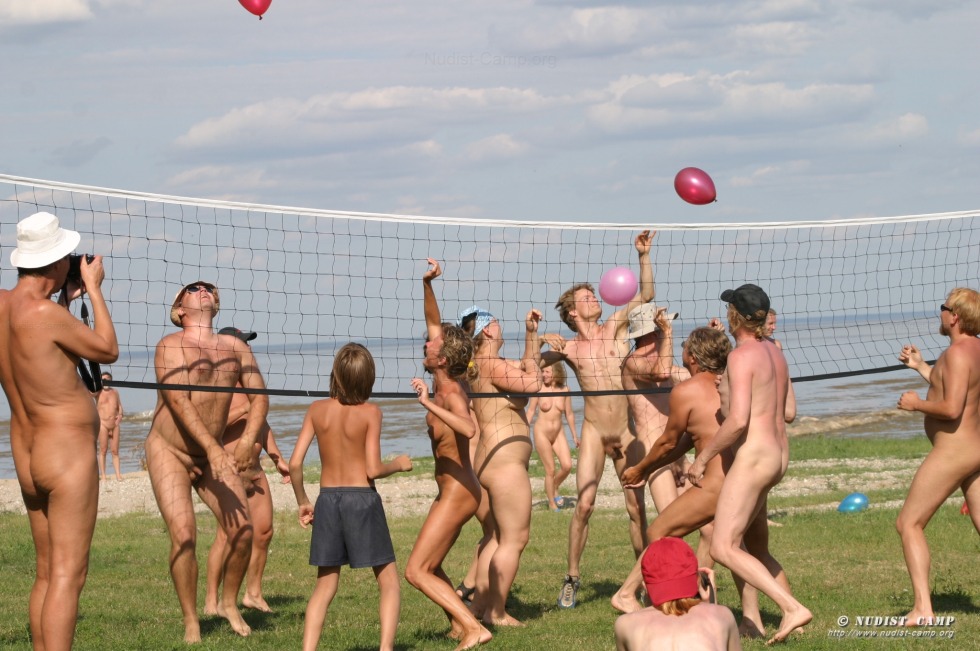 Nudists play among boys