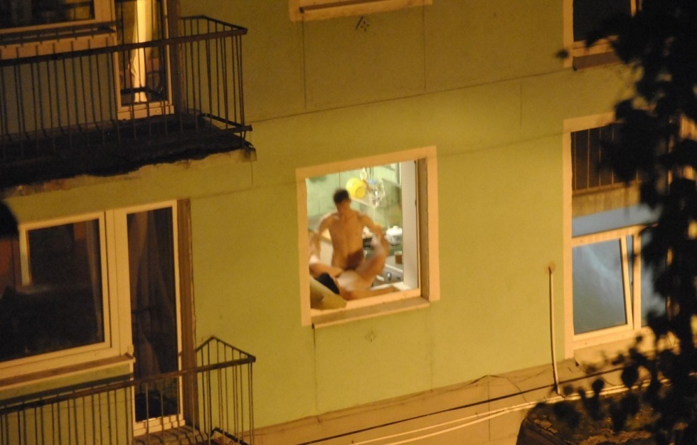 Naked in the windows of neighboring houses