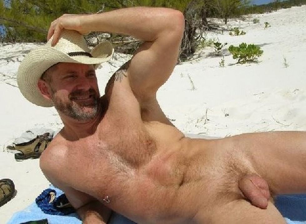 Adult man naked on the beach