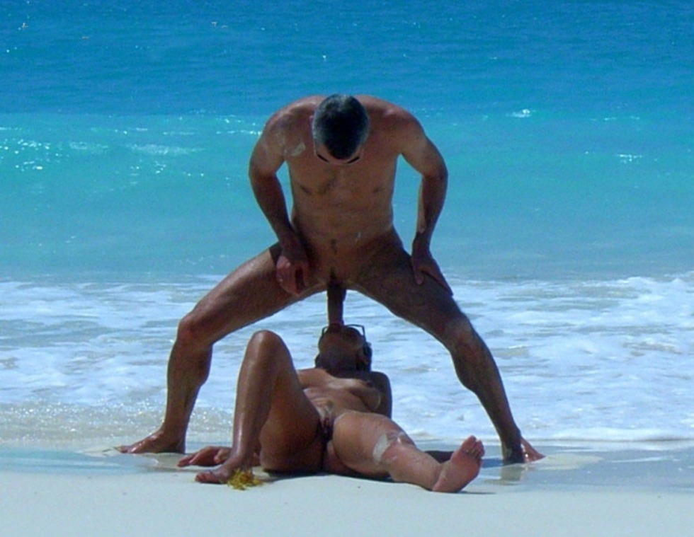 A guy with a huge member on the beach