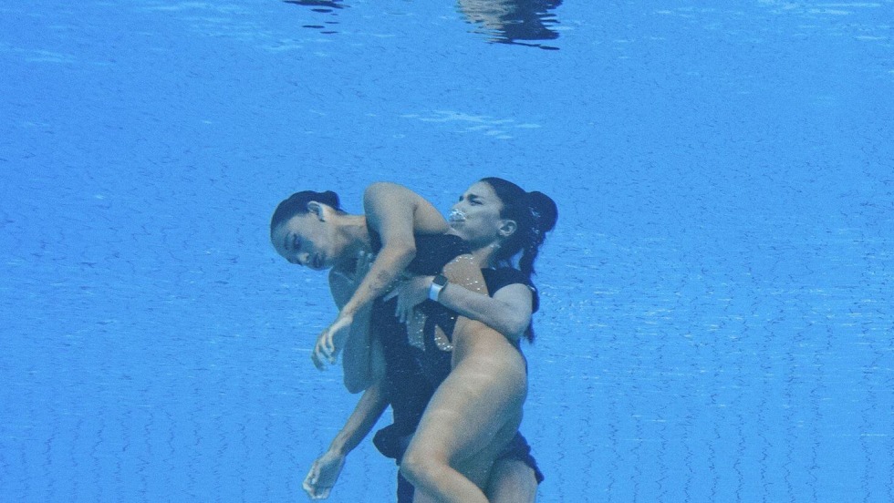 Naked swimmers in the pool