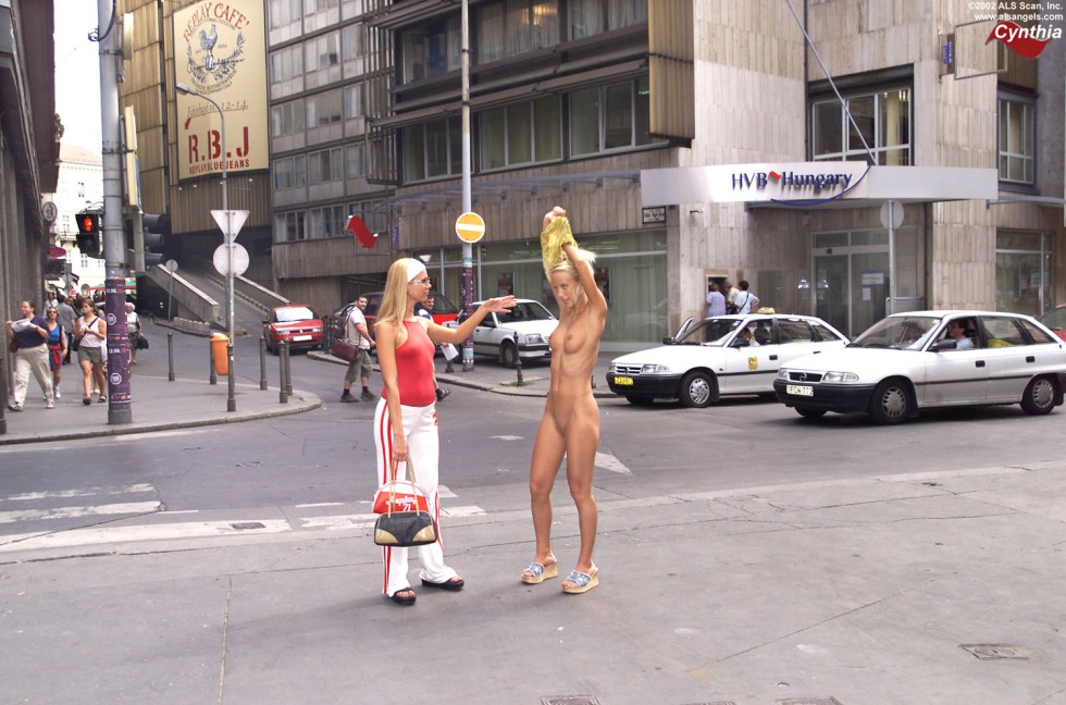 Naked exhibitionist among people