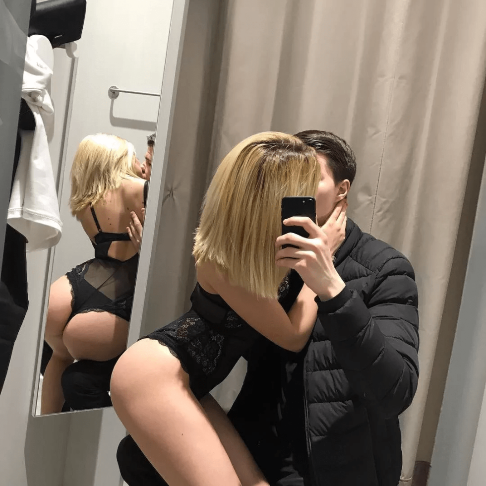 A guy with a girl in the fitting room