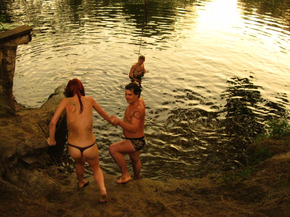 Friends naked on the river