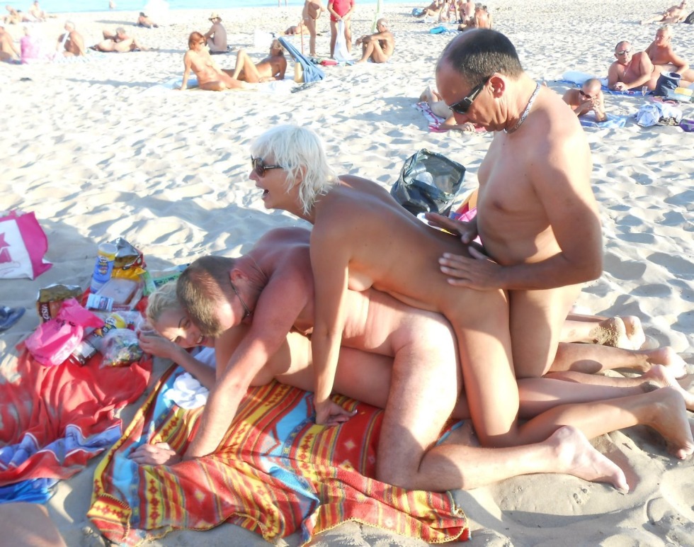 Swingers on a nudist beach