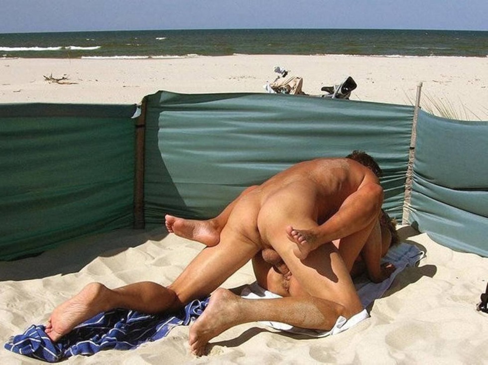 Naked girls on the beach with men
