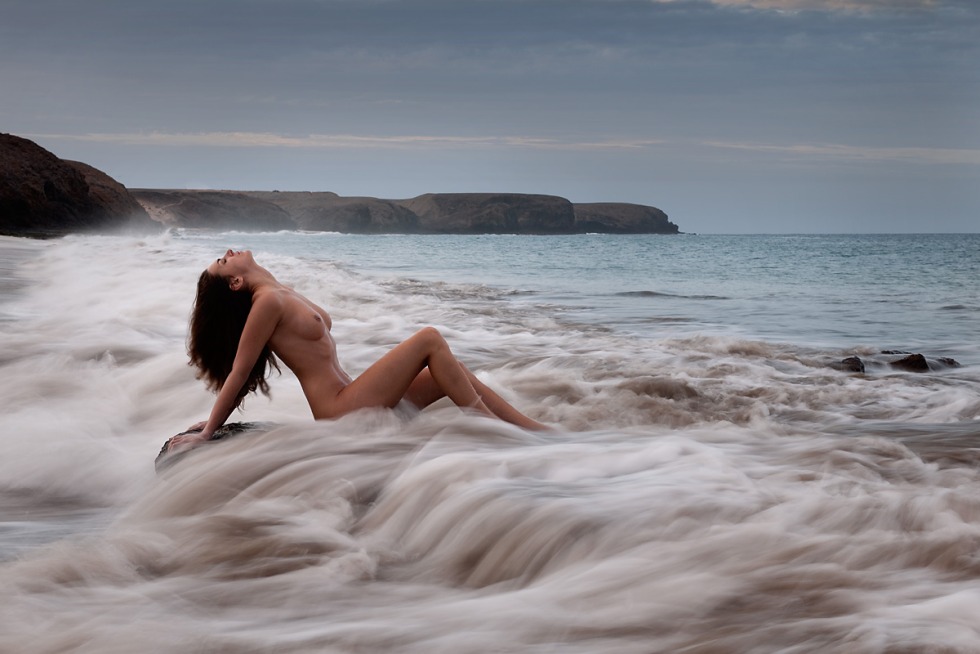 Photo shoot on the shores of the sea nude