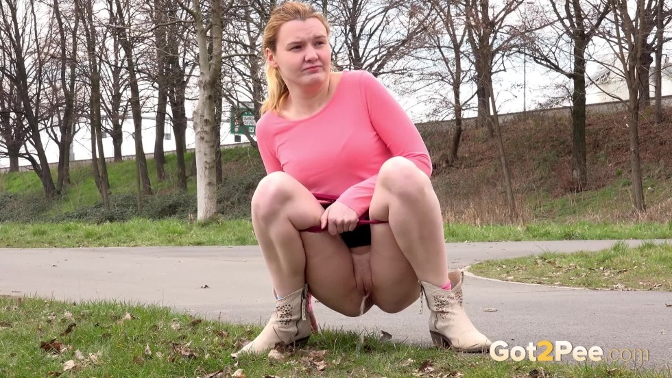Fat woman pouring on the street