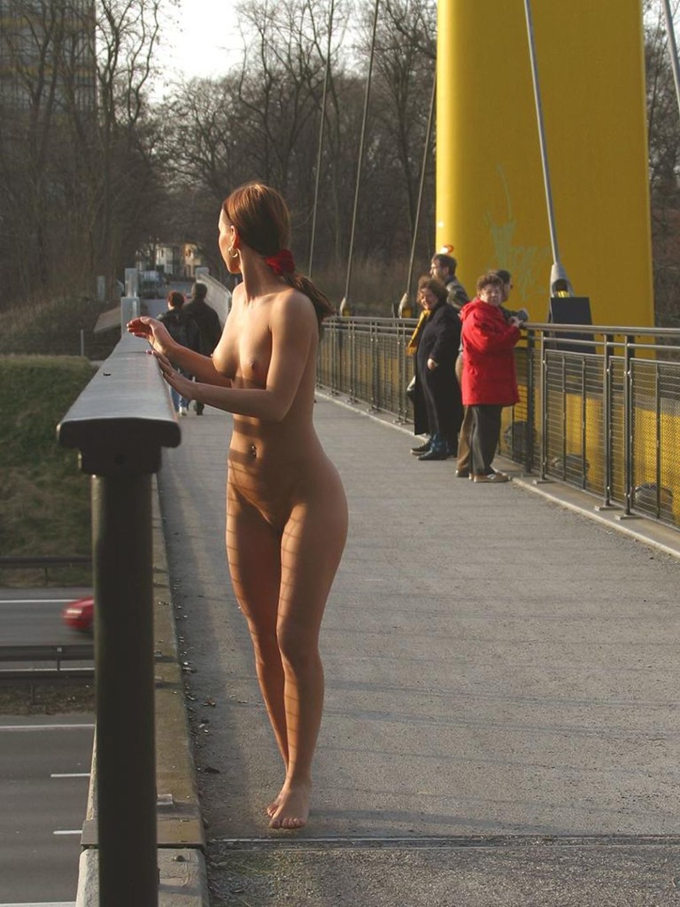 Naked woman walks on the street