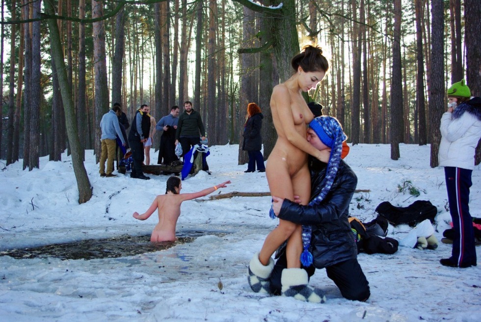 Naked women in winter in the hole