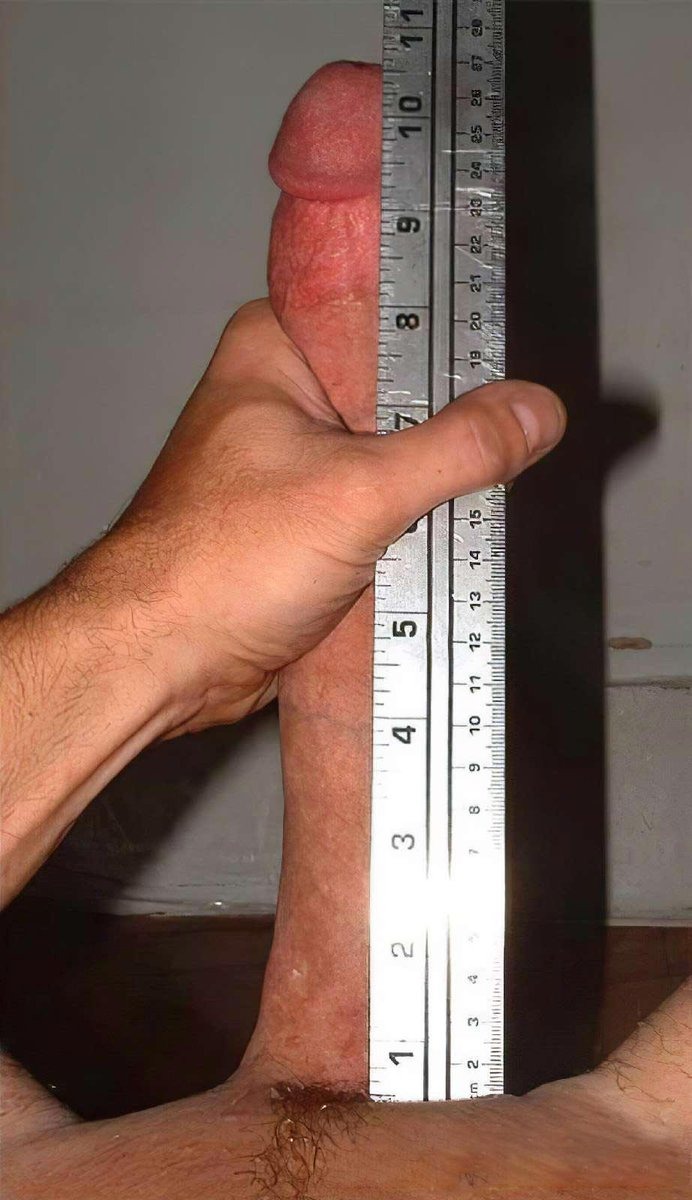 Male penis with a ruler