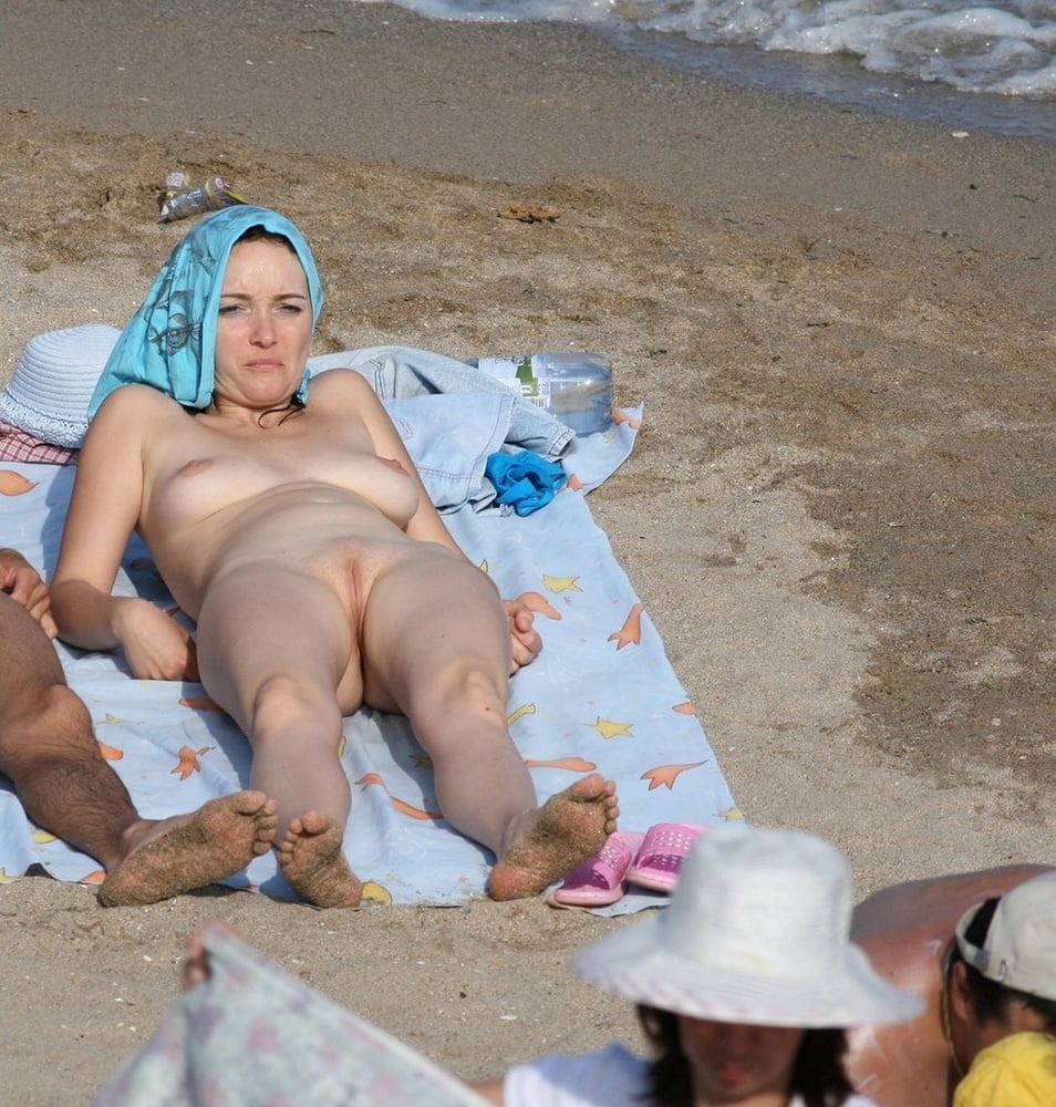 Husband and wife on a nudist beach