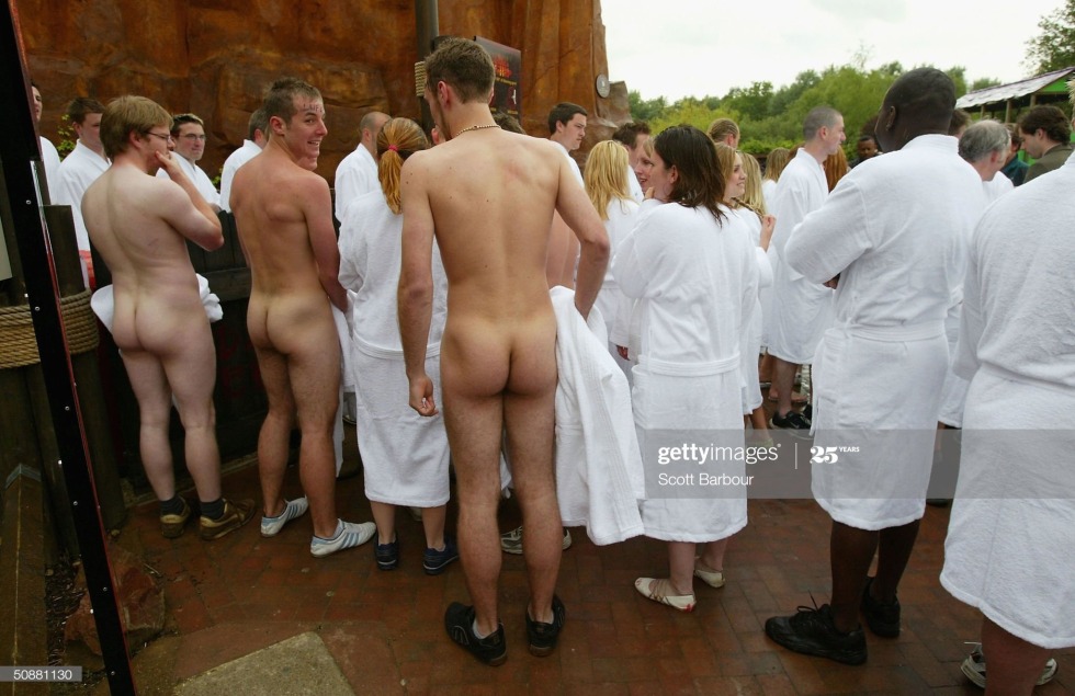 Women examine naked men