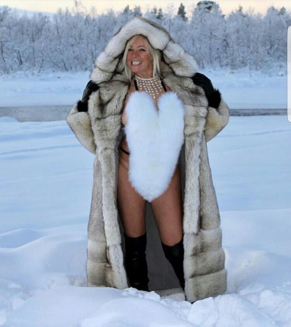 Photo shoot in a fur coat and underpants