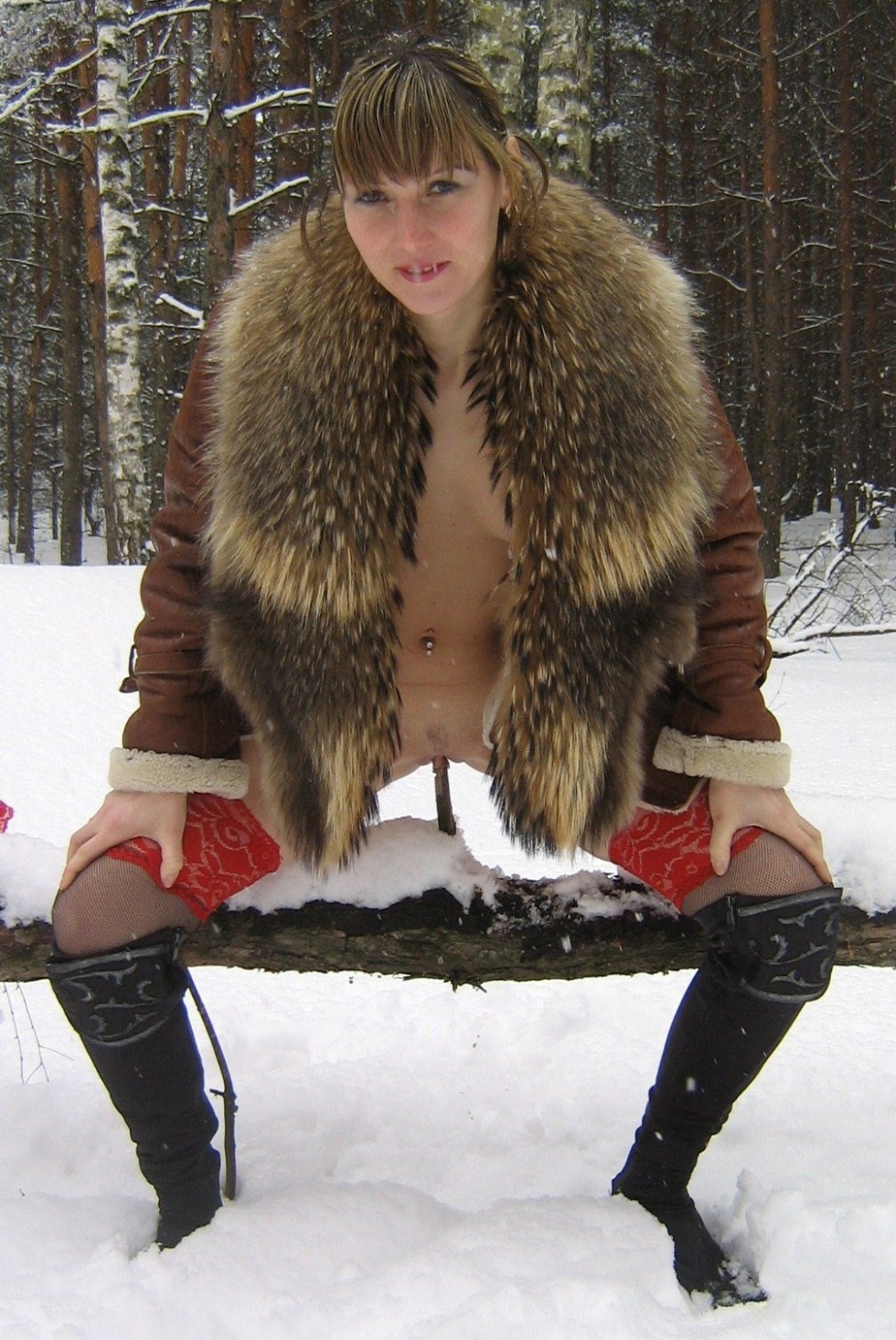 Women naked in fur coats in winter