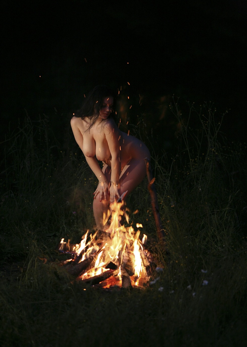 Naked girls by the fire