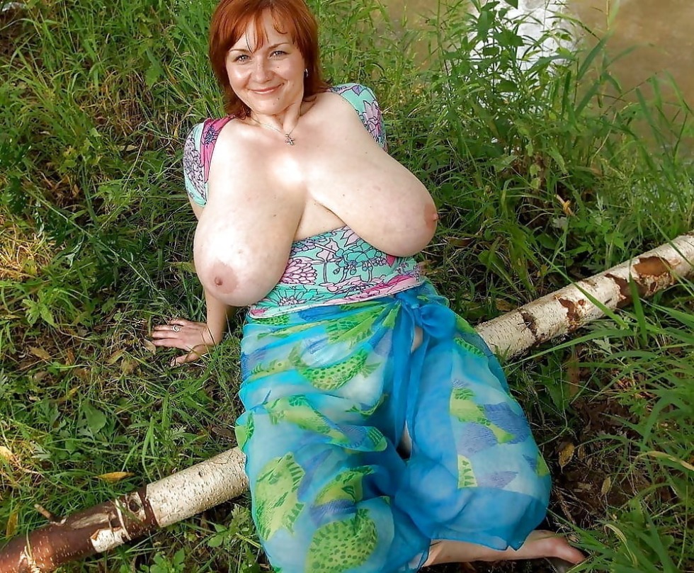 Woman with big tits in the garden