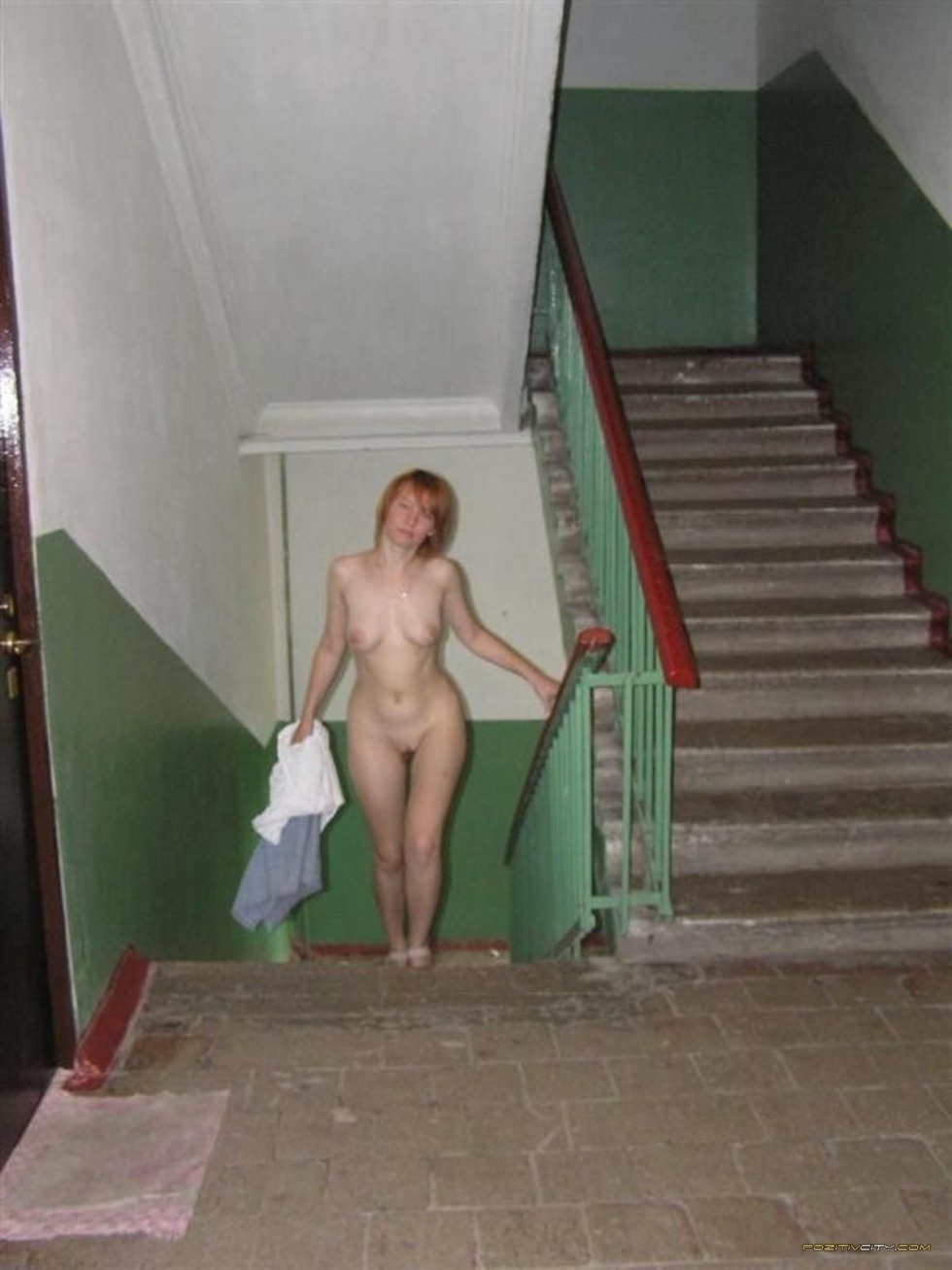 The girl undressed in the entrance