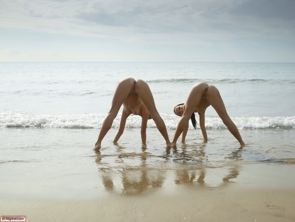 Naked yoga on the seashore