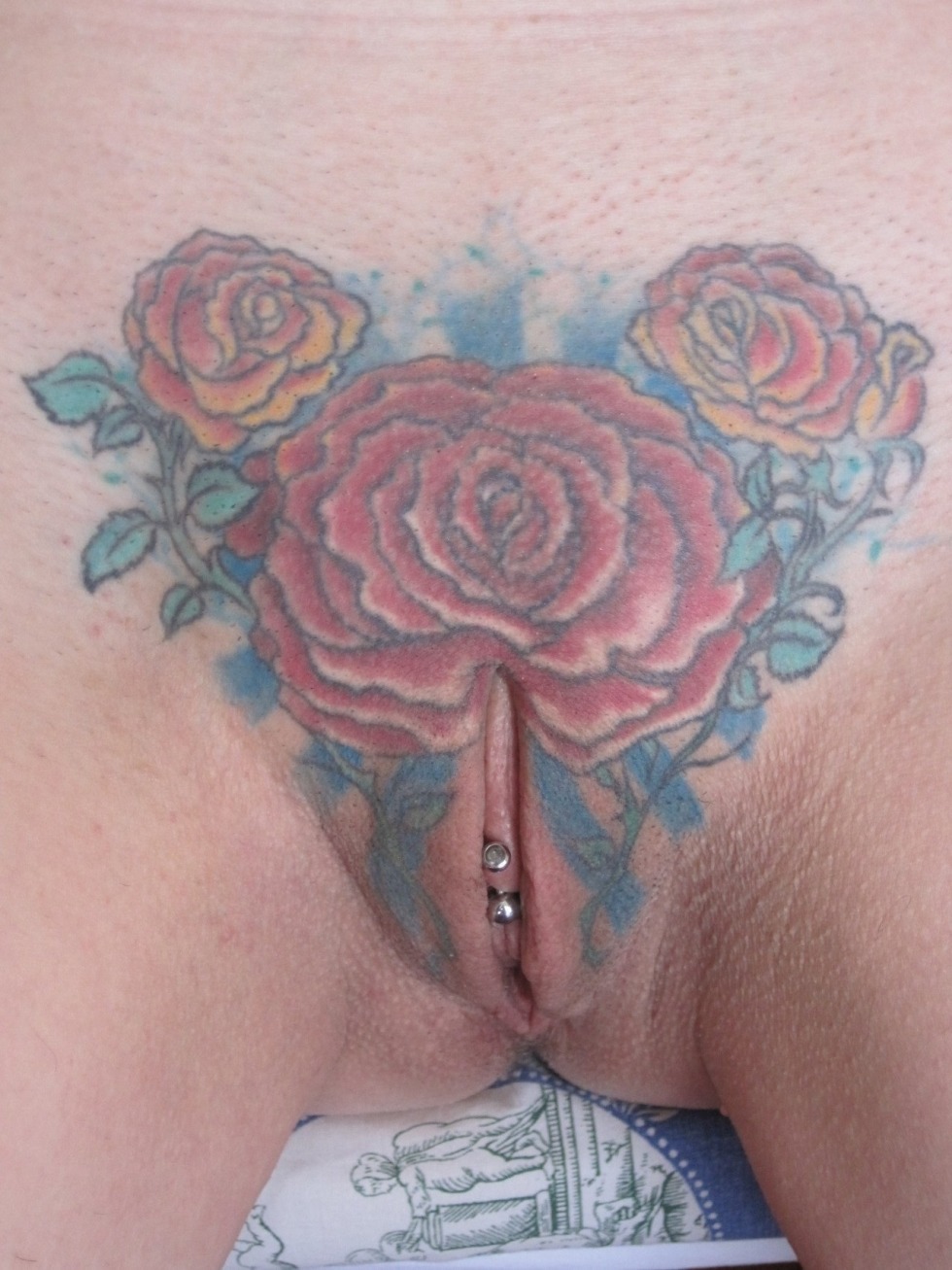 Female intimate tattoo on the pubis