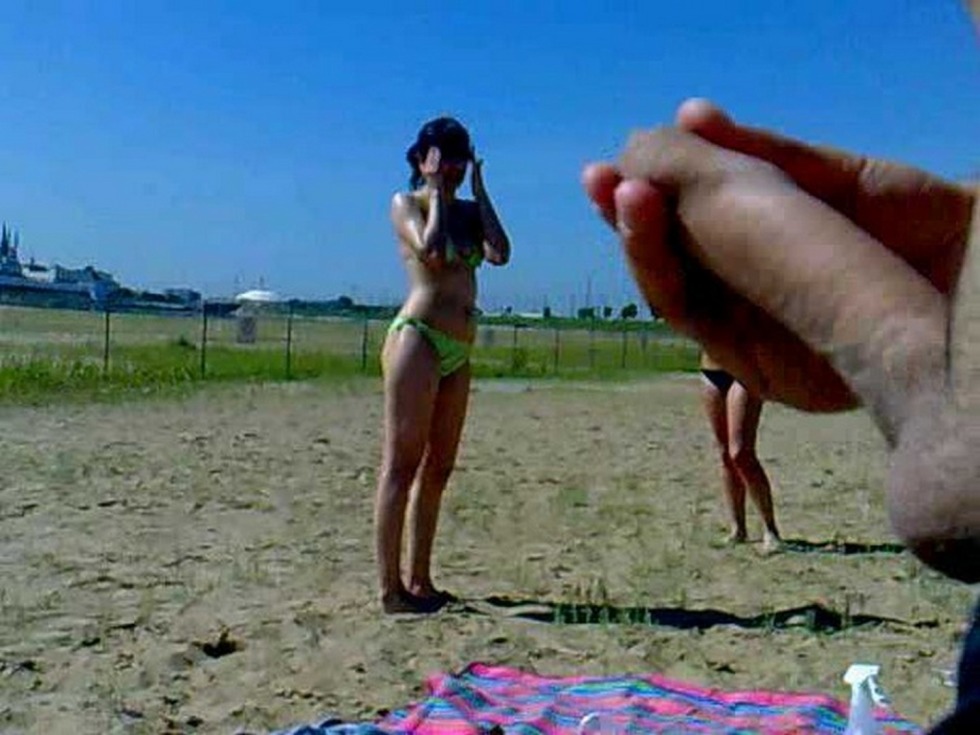 Exhibitionism of the girl on the beach