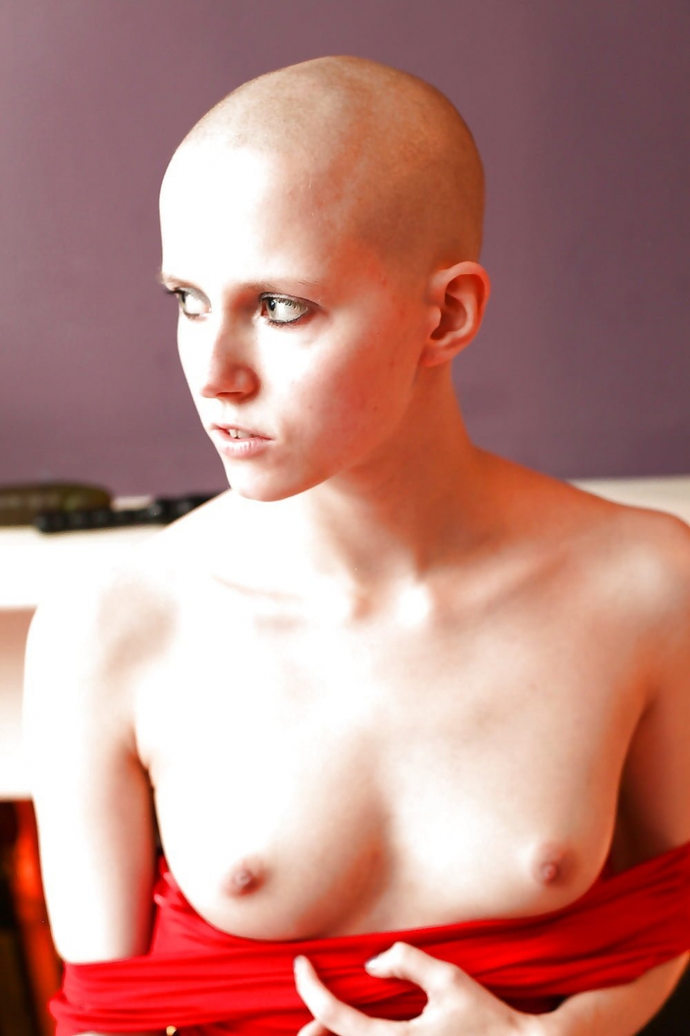 Naked with shaved head
