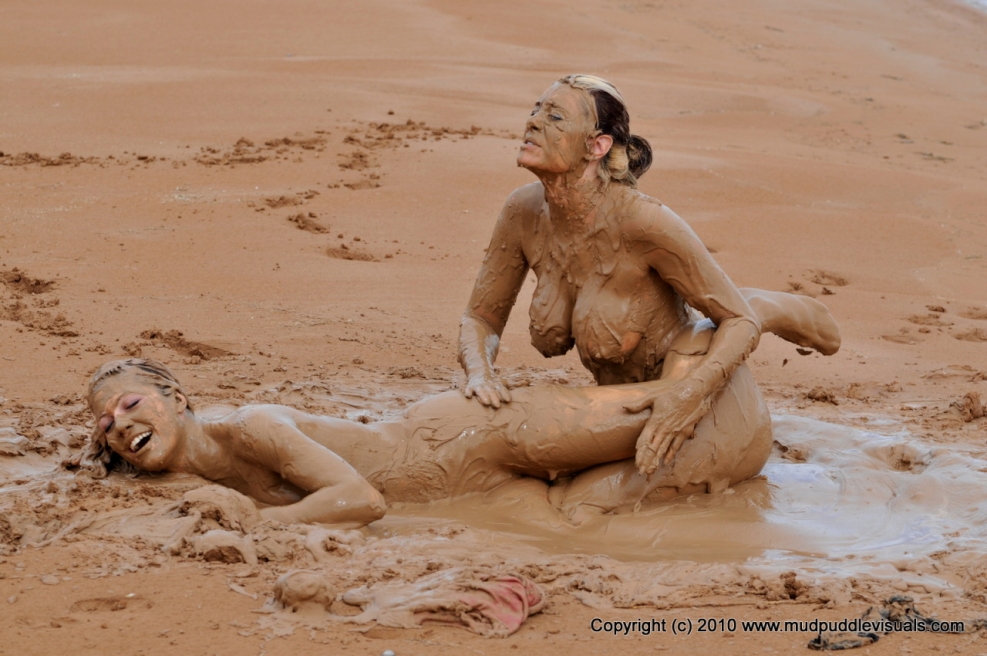 Girl in mud without clothes