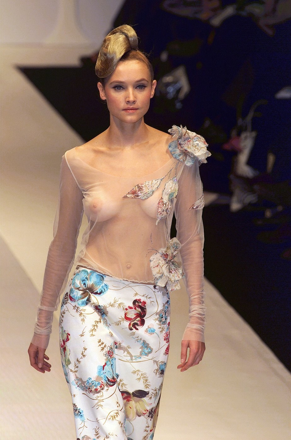 Fashionable showing with bare breasts