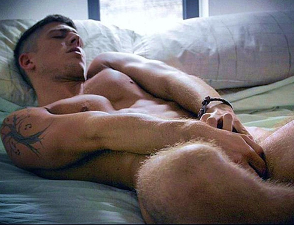 Two bare guys in bed
