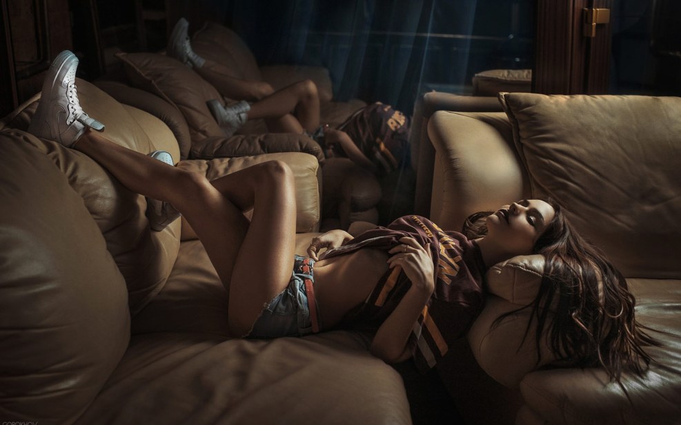 Two beautiful girls on the couch