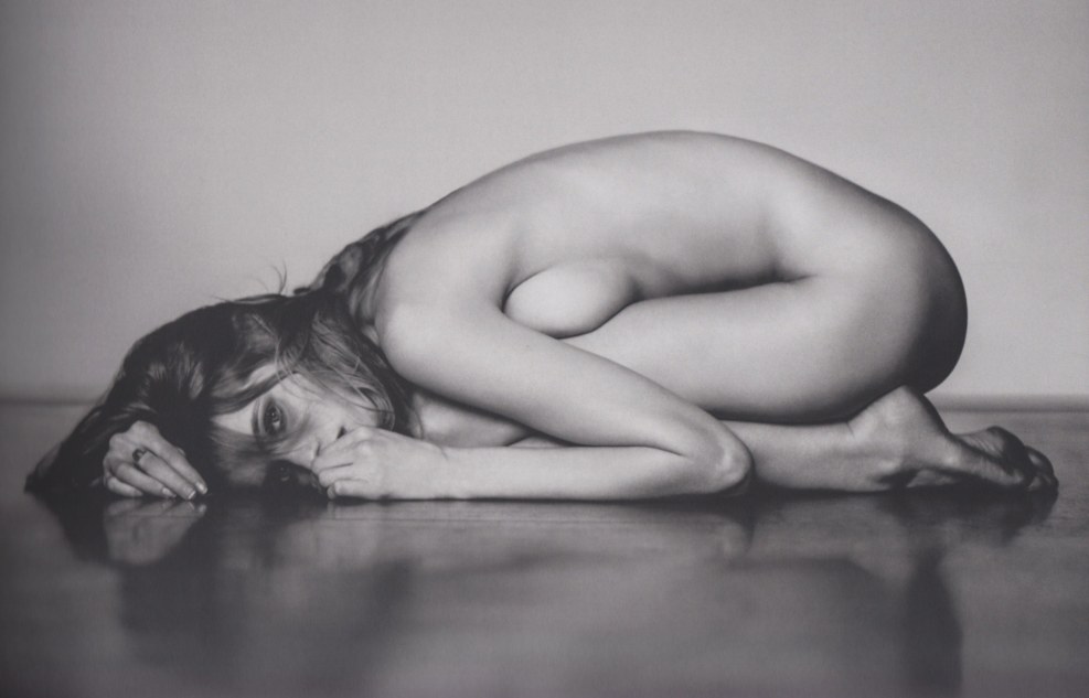 Poses for a photo shoot in the style of nude